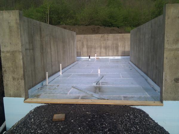 Foam and plumbing in place ready for radiant tubes to be installed.  We have not hooked up the radiant tubes, but they're in place for possible future use to provide a heated basement.