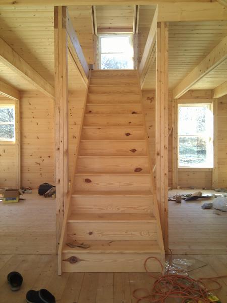The prefab staircase between the first and second floors.  Eventually there will be a wall around the opening with a door to the basement stairs.