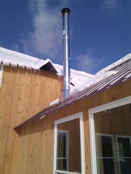 Installing the chimney pipe was one step we hired out but should have done ourselves.  The pipe leaks when snow piles up and then melts on warm days.  Eventually we may have to replace the flashing with a high-temp silicone boot.