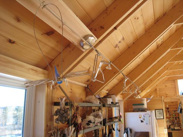 We used low-voltage track lighting by Tech Lighting in the kitchen (shown here) and in the upstairs work area.