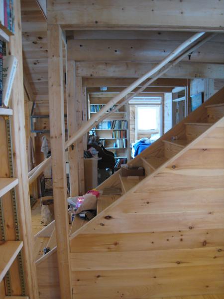 View towards the bedroom from the east end of the piano room, showing how we tried to keep the house open with long sight lines.
