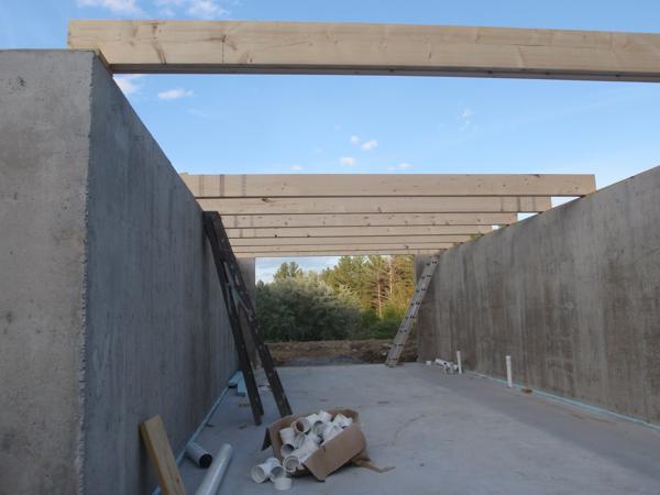 Beams for the one-story section partially installed.