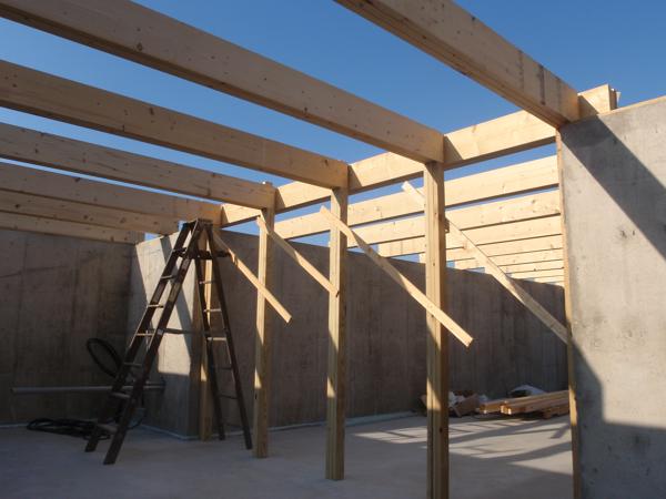 Five beams for the two-story section have ends that didn't rest on a foundation wall, so we had to construct posts to support those ends.