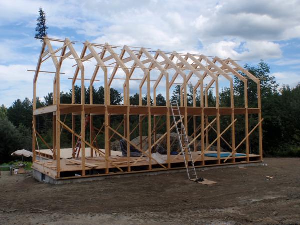 Rafters for the second floor installed and braced. Note the evergreen branch for good luck.