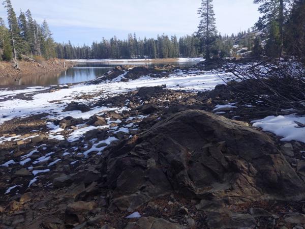 I visited Upper Rock Lake in November, after a light snowfall.  The water level was very low.  To take this picture, I was standing where the water would have reached back in June.