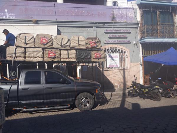 Unloading coffins at a funeral parlor, Ajijic.