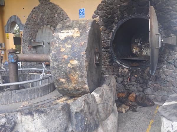 The ovens and stone press at a tequila factory.