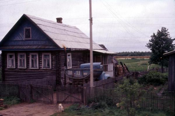 Log cabin, near Novgorod.  Picture taken from a moving train.  The Intourist tour guides would never have let us visit such a humble village.