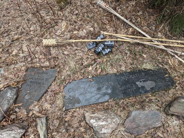 Memorials and torches on Rochester Mountain