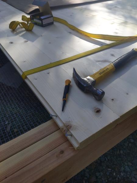 The 2x6 tongue and groove flooring is nailed down using 6d box nails through the tongue.  This way there are no exposed fasteners.  The punch is used to drive the nail the final 1/4 inch.  The rachet strap pulls in the board against the previous one during nailing.