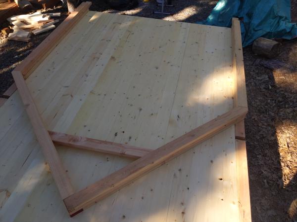 Test layout for first post/rafter unit, which is called a bent in timber framer jargon.  The 15 pieces will be used as templates for the remaining 4 units.  The walls will be 6 feet high, the collar tie will be 8 feet above the floor, and the peak will be 10 feet above the floor.