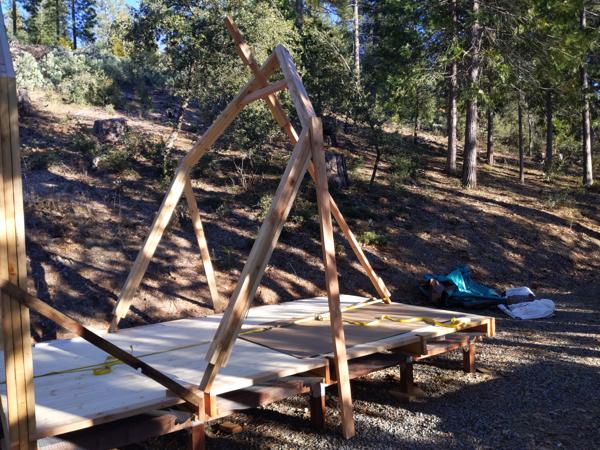 Now I used a 12 foot board with cleats screwed to it to push up on the collar tie.  The bottom of the board was secured with a ratchet strap.  Eventually I was able to push the bent up without the ratchet strap.