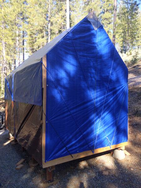 I covered the entire structure with tarps in preparation for the snow and rain this coming weekend.  The wall tarps were easy; the roof tarp was very difficult because it was about six inches too short.