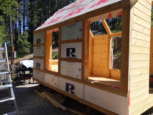 Insulation on the west wall.  The 1.5 inch rigid foam is fastened to the walls with 1x4 or 1x6 strapping (rough lumber).  I used screws instead of nails.  Later, the vertical shiplap siding boards will be attached to the strapping.