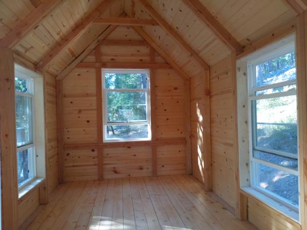 Three windows with trim, and finished (polyurethane) floor on north end.