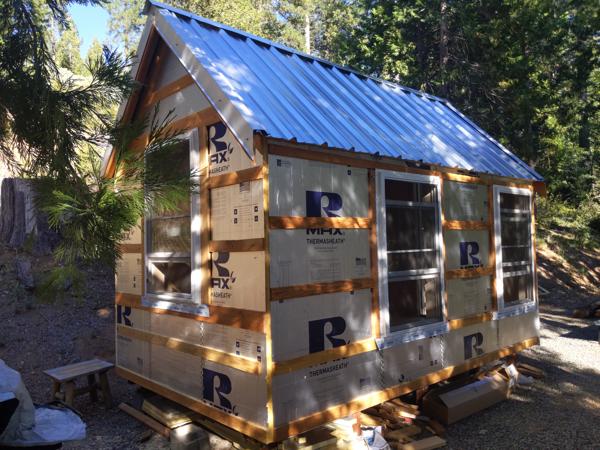 The north end trim and drip edge, and the west roof with the ridge cap.
