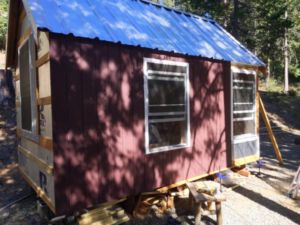The shiplap siding finally arrived.  It is pre-primed, saving some work.  I painted the boards before installing them.