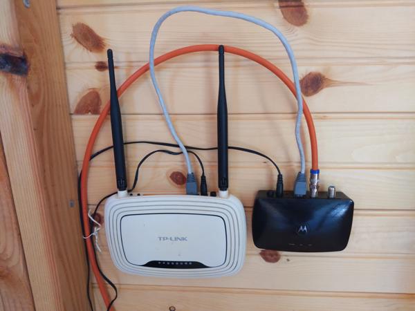 To get internet, I ran a 250 foot coax cable (the orange one) from the main house to the tiny house, with a coax-to-ethernet adapter at each end.