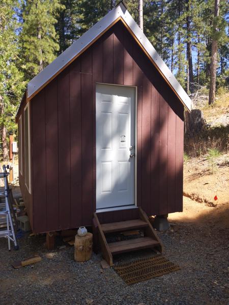 The siding and entry stairs are done.