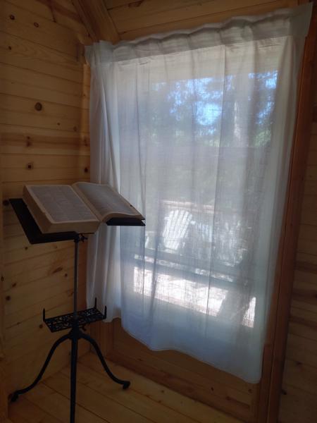 The curtains block the rather strong mid-day sun, but let in some light.